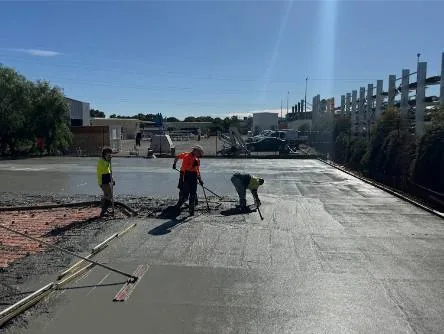 Envision crew screeding a large commercial concrete slab pour in Adelaide